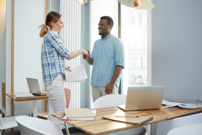 an employer and an employee doing a handshake