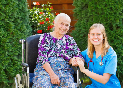 senior patient and a doctor smiling